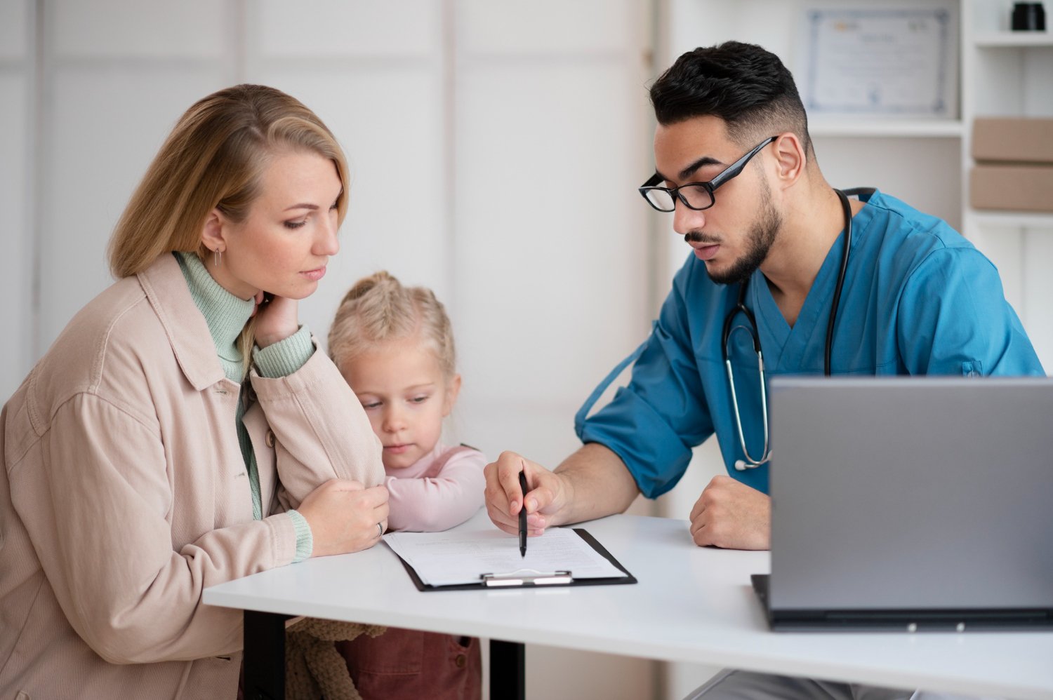 Parents discussing their child's healthcare with an experienced pediatrician in Kukatpally