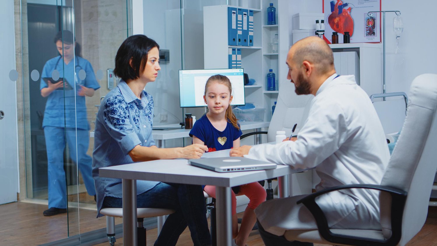 Parents discussing child healthcare with a pediatrician in Kukatpally before choosing the right doctor