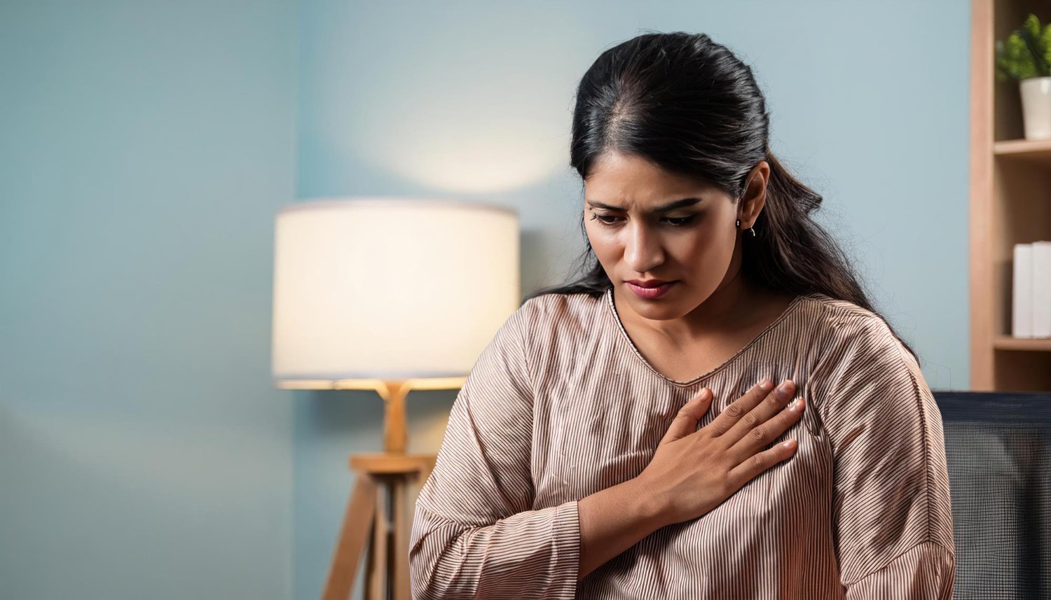 Woman experiencing shortness of breath during daily activities, a possible symptom of heart disease.