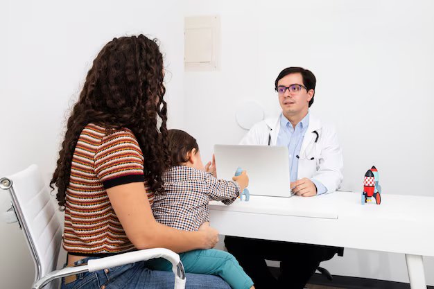 Parents discussing child health concerns with a Pediatrician at Srinidhi Heart & Child Clinics in Kukatpally