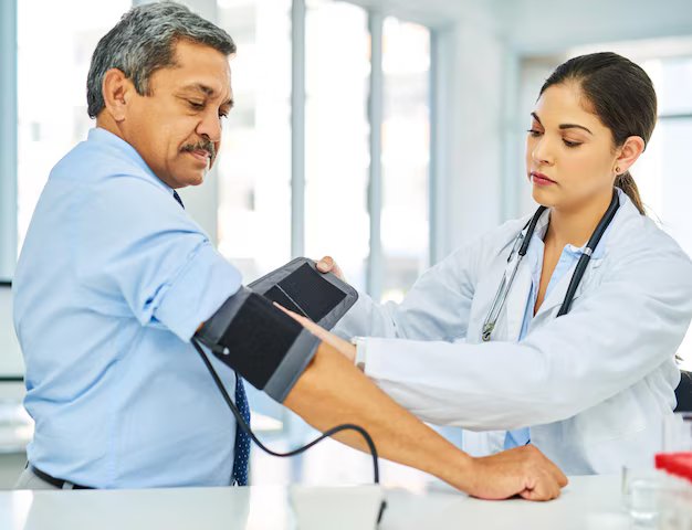 Cardiologist performing a preventive heart checkup for an adult patient